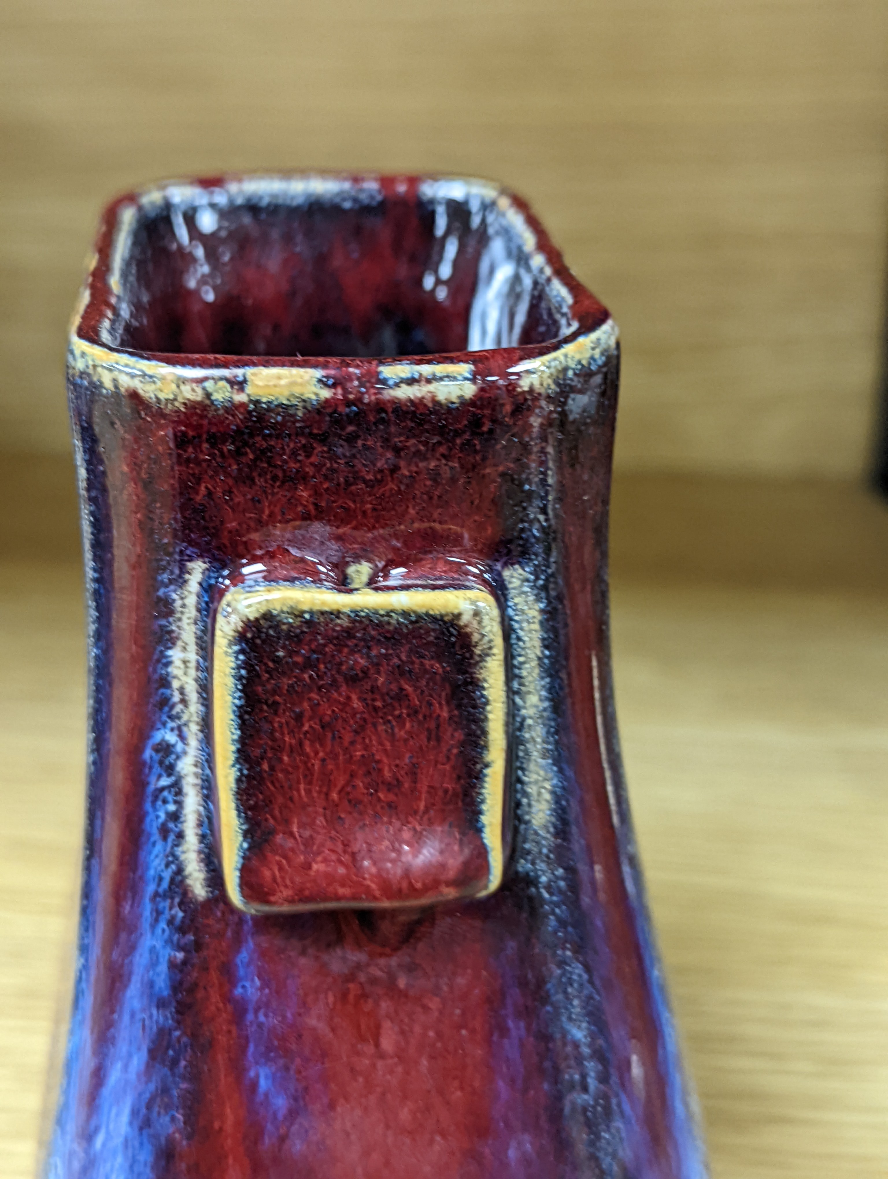 A Chinese sang de boeuf arrow vase 17cm